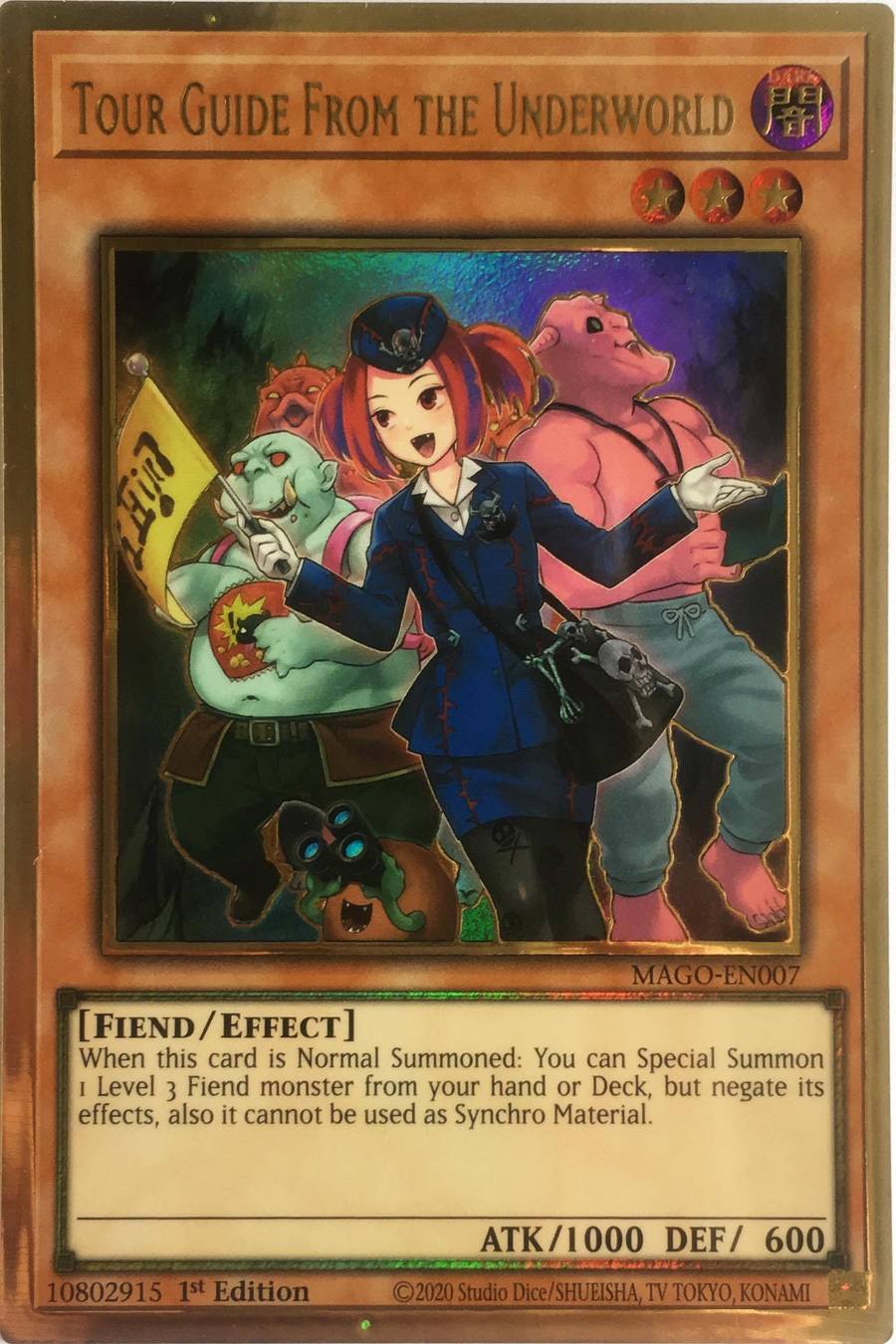 Tour Guide From the Underworld (alternate art) / Gold - MAGO-EN007 - 1 Transcend Cards Tour Guide From the Underworld (alternate art) / Gold - MAGO-EN007 - 1 Transcend Cards